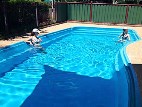 Relax by the pool at Roma Motel